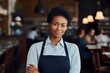 © vasyan_23 - happy african american woman waiter in restaurant, cafe or bar