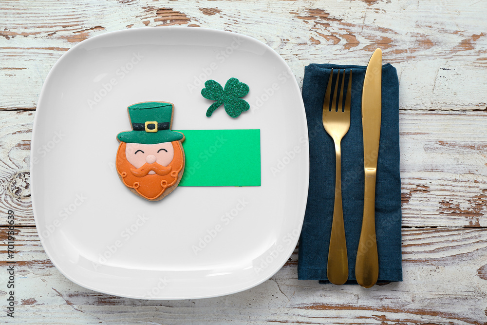 Beautiful table setting for St. Patrick's Day celebration on light wooden background