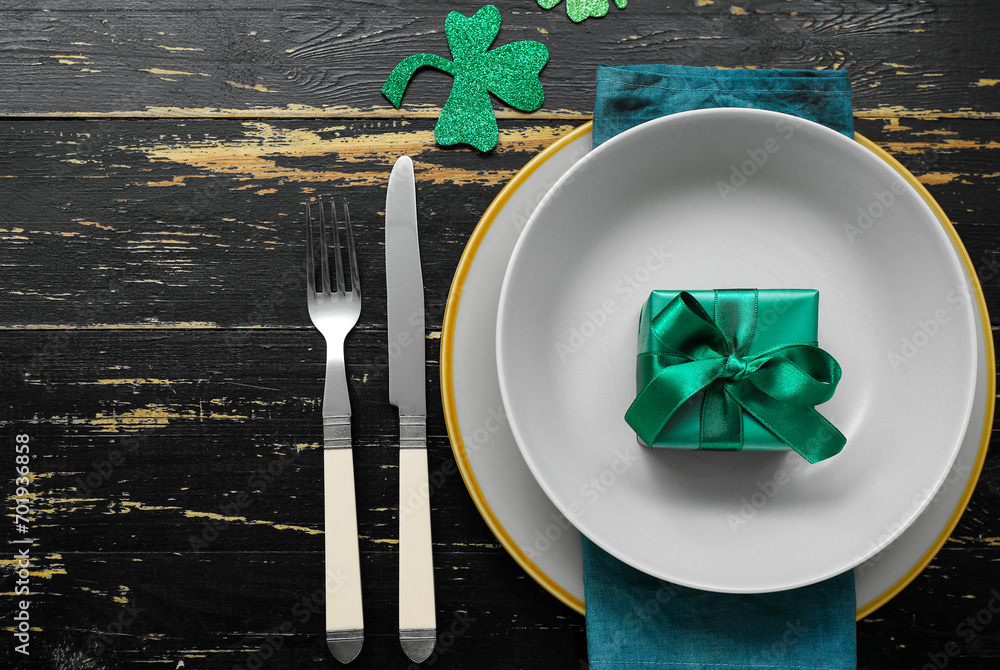 Beautiful table setting for St. Patrick's Day celebration on dark wooden background
