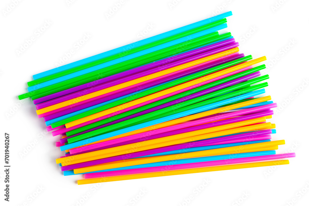 Heap of colorful plastic straws on white background