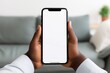 © Oksana - African american man holding smart phone white mockup display, empty screen for app ads. Mobile applications technology concept, close up view