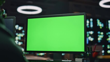 IT man coding green screen pc at datacenter closeup. Developer programming code