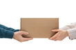 © ilyaska - Male hands giving a package, female hands receiving a package. Purchase delivery concept, Parcel delivery