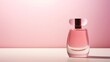 A close-up shot of a minimalist pink perfume bottle standing against a neutral backdrop.