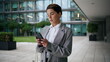 © stockbusters - Annoyed businesswoman text phone at office center. Nervous executive send reply