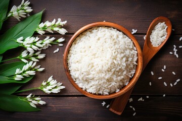 Sticker - Top view of Thai jasmine rice on wood spoon in bamboo basket with wood background for organic and healthy food