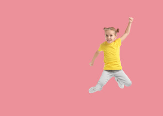 Wall Mural - Cute girl jumping on pink background, space for text