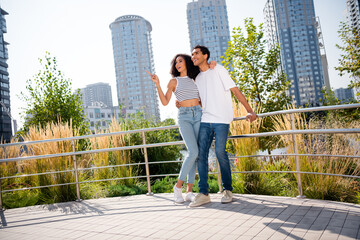 Canvas Print - Photo of dreamy sweet married couple dressed casual outfits embracing enjoying sightseeing together outdoors urban city park