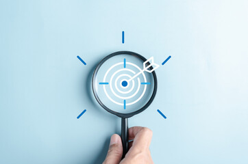 Wall Mural - Magnifier glass focus to target objective with idea creative light bulb icon. planning development leadership and customer target group concept.