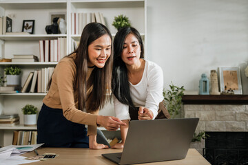 Wall Mural - Two female accountants have a team meeting to summarize financial information in the office