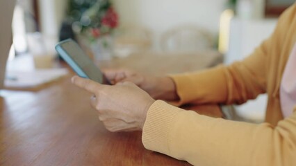 closeup Finger of woman touching scroll page app on mobile phone at room.Manager typing telephone alone watch film online.