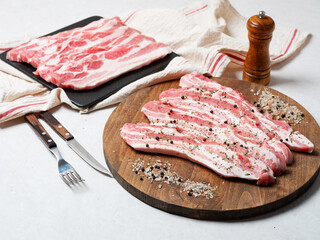 Wall Mural - Raw meat and spices on wooden board	