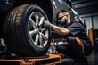 auto mechanic changing a wheel on a car in a car repair shop, Car mechanic working in garage and changing wheel alloy tire, AI Generated