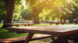 wood picnic tables in the park blurry background