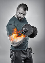 Wall Mural - Fitness trainer burning biceps in a workout