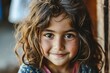 Portrait of a beautiful little girl with long hair and freckles