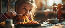 Cute Little Kid Girl Eating Spaghetti Bolognese At Home. With Copy Space Image. Place For Adding Text Or Design