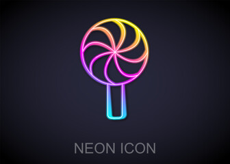 Sticker - Glowing neon line Lollipop icon isolated on black background. Candy sign. Food, delicious symbol.  Vector