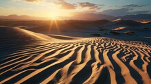 Sunset Over Sand Dunes And Mountains In Desert Landscape