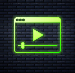 Canvas Print - Glowing neon Online play video icon isolated on brick wall background. Film strip with play sign.  Vector