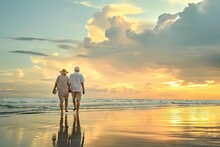 Eternal Love. Old Mature Couple Walking On Beach At Sunset. Romantic Getaway. Senior Embracing Beauty Of Sunset. Sun Kissed Moments. Retired Enjoying Stroll Together