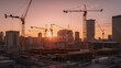 © Boris - Sunrise with silhouetted cranes and buildings in industrial construction