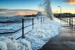 Wave engulfs Amble Pier.  Amble Harbour is actually called Warkworth Harbour and is set on the banks of the River Coquet in Northumberland in the North East of England