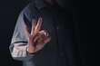 © poomsak - Businessman's hand making OK sign