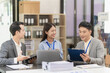 © ArLawKa - Team of successful Asian businessmen in suits working in conference room to discuss brainstorming, computation, analysis together on company growth goals and gross profit margins.