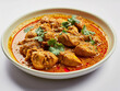 © Aisyaqilumar - A plate of delicious chicken curry with a white background. Complete with spice ingredients.