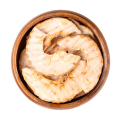 Wall Mural - Riffled apple chips, a healthy snack, in a wooden bowl. Dehydrated, wavy cut apple slices, sweet chips or crisps with a dense and crispy texture. Close-up, from above, isolated over white, food photo.