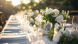 © john - Beautiful outdoor table setting with white flowers for a dinner, wedding reception or other festive event.