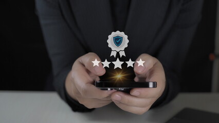 Wall Mural - customer man hand pressing on smartphone screen with gold five star rating feedback icon and press level excellent rank for giving best score point to review the service