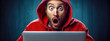 hacker, astonished expression, peering over the top of a laptop screen, wearing a red hoodie. The person's wide eyes and open mouth convey a sense of shock or surprise, set against a blue background