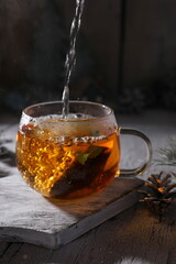 Poster - Hot black tea in a transparent glass