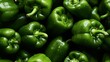 Ein Hintergrundbild von grünen Paprika als endloses Muster.