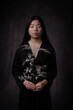 © Milou Dirks - classic renaissance portrait of an asian woman in black dress  holding silver brances