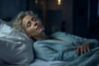 © Ahmed - Tired middle aged woman lying in bed can't sleep late at morning with insomnia. Adult lady sick or sad depressed sleeping at home