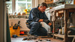 Plumber or maintenance worker crouched down, inspecting or repairing a kitchen sink