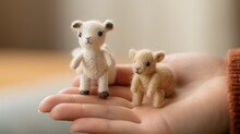 Close-up Of Hands Needle Felting Cute Animal Figures From Yarn