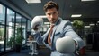 © Alejandro Morón - Businessman with boxing gloves in the office