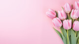 Fototapeta Tulipany - Delicate pink tulip on a pink background. Space for text or design.