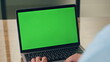 © stockbusters - Businessman using chroma key laptop table closeup. Unknown boss looking computer