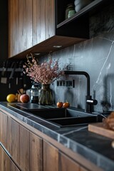 A picture of a kitchen featuring a sleek marble counter top and elegant wooden cabinets. Ideal for showcasing modern interior designs and home decor concepts