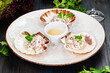 Ceviche. Finely chopped raw squid marinated in lemon juice served in seashell.