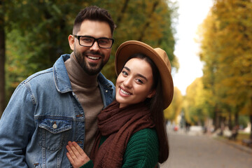 Poster - Happy young couple spending time together in autumn park