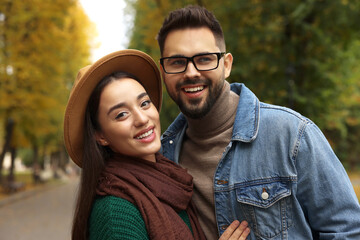 Poster - Happy young couple spending time together in autumn park