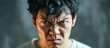 Angry Asian man with white skin, shirt, black hair, adult age.
