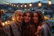Group of happy muslim women wearing hijab taking selfie with mobile phone at sunset
