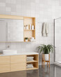 © bongkarn - A modern, minimal bathroom with a minimal wooden vanity sink and a mirror with cabinet.